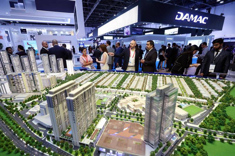 Dubai, United Arab Emirates - October 02, 2018: People look at models at the Sobha booth at Cityscape Global 2018. Tuesday, October 2nd, 2018 at World Trade Centre, Dubai. Chris Whiteoak / The National