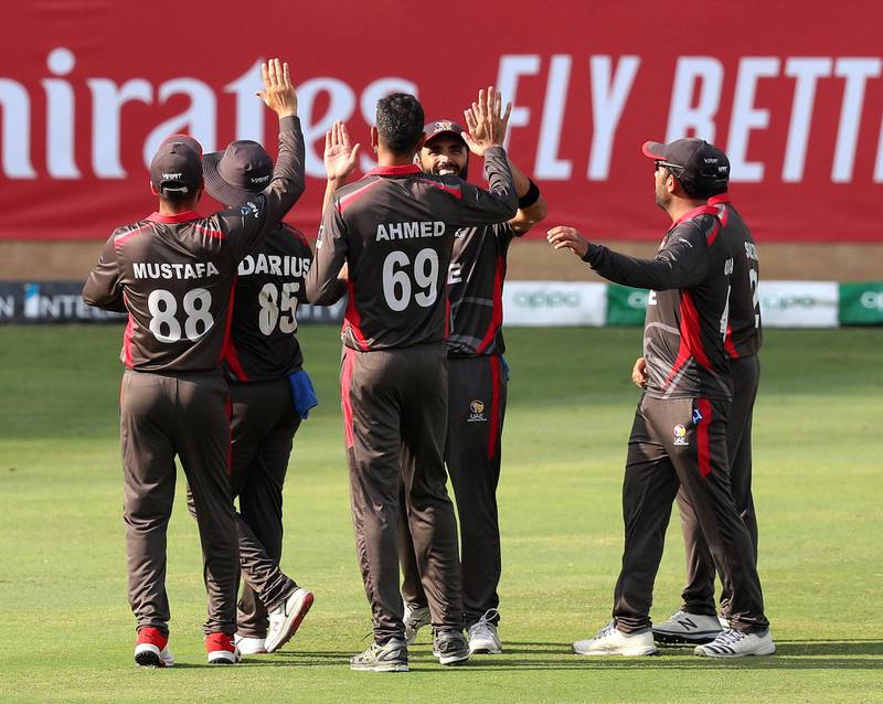 Dubai, United Arab Emirates - October 30, 2019: Ahmed Raza of the UAE takes the wicket of George Munsey of Scotland during the game between the UAE and Scotland in the World Cup Qualifier in the Dubai International Cricket Stadium. Wednesday the 30th of October 2019. Sports City, Dubai. Chris Whiteoak / The National