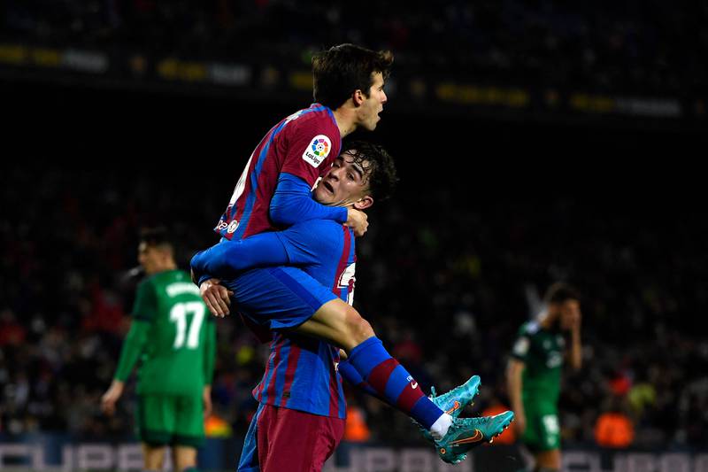 Riqui Puig celebrates with teammate Gavi after scoring for Barcelona against Osasuna. AFP