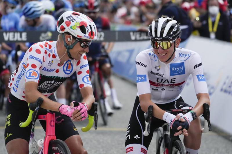 Magnus Cort Nielsen, wearing the best climber's dotted jersey, and UAE Team Emirates' Tadej Pogacar, wearing the best young rider's white jersey, before Stage 3. AP