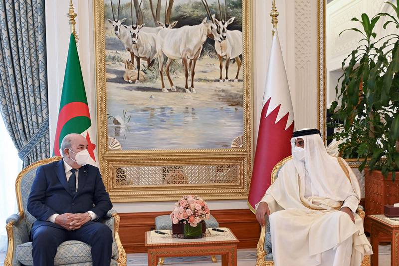 Qatar's Emir Sheikh Tamim bin Hamad Al Thani (R) receives Algerian President Abdelmadjid Tebboune at the Emiri Diwan in Doha. AFP