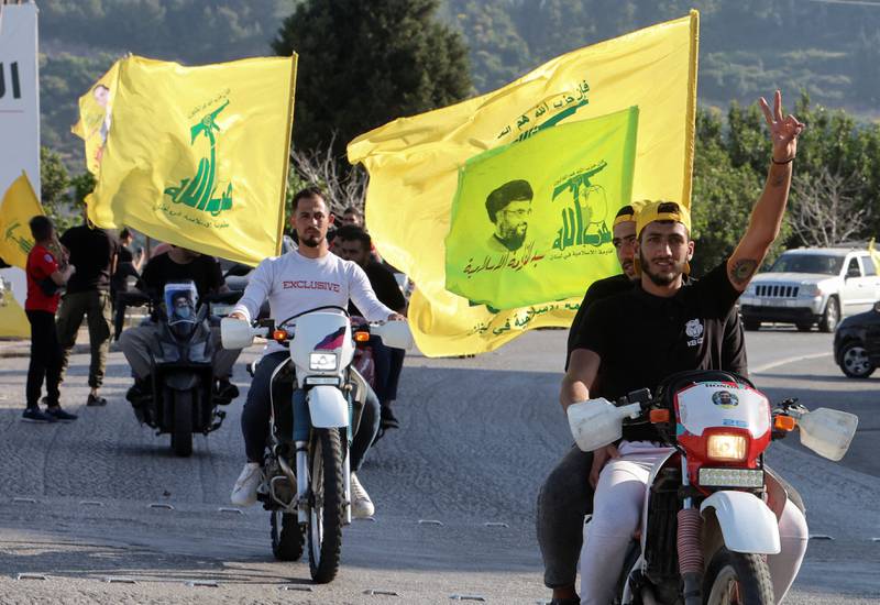 Supporters of Lebanon's Hezbollah parade in Kfar Kila village near the border with Israel in southern Lebanon. Reuters