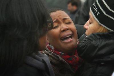 Cleopatra Cowley-Pendleton is comforted near a Chicago park where her daughter Hadiya was killed on January 30.