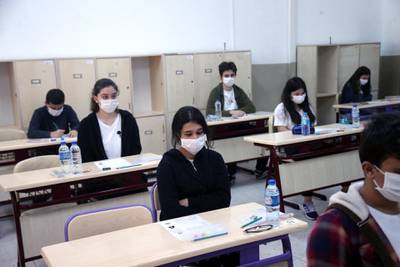 Students of 8th grade wearing masks waits for their High School Transition System (LGS) examination at the Fevzi Ozbey secondary school in Ankara, Turkey. EPA
