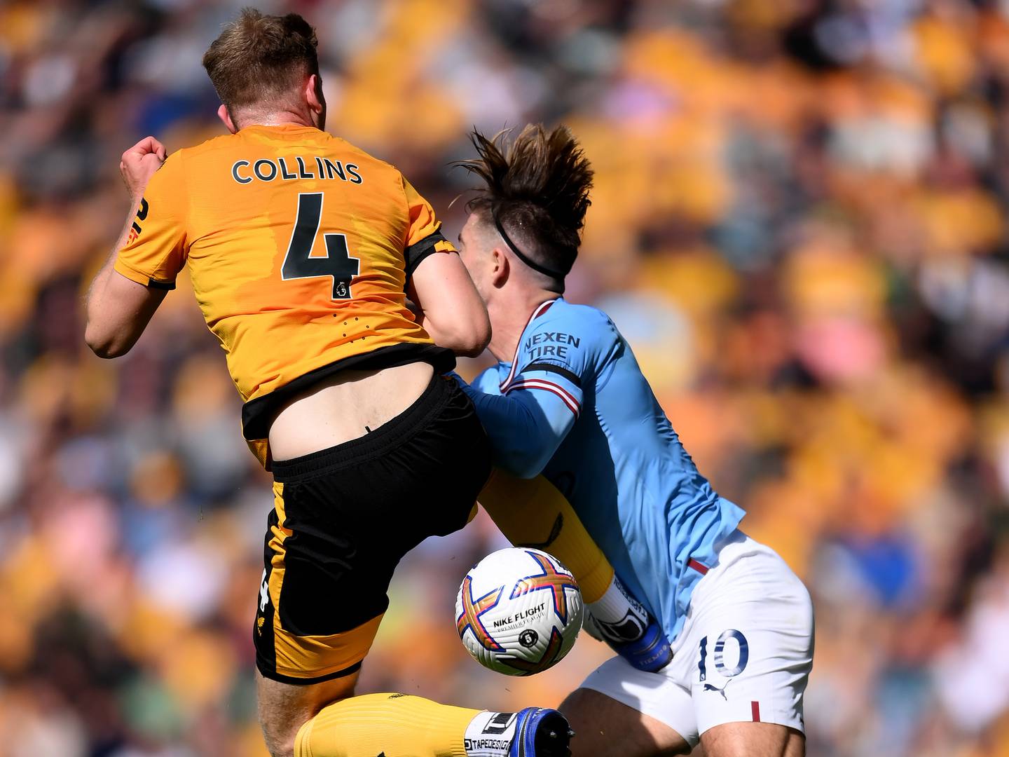 Wolves' Nathan Collins was shown a red card for this challenge on Jack Grealish of Manchester City. Getty