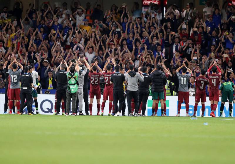 Al Ain, United Arab Emirates - January 14, 2019: Thailand celebrate at the end of the match after the game between UAE and Thailand in the Asian Cup 2019. Monday, January 14th, 2019 at Hazza Bin Zayed Stadium, Al Ain. Chris Whiteoak/The National