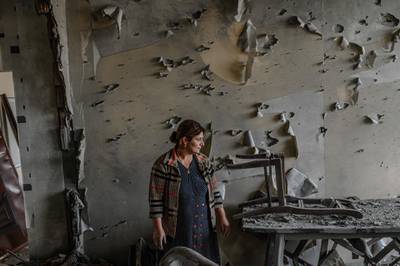 Xatire Celilova stands inside her destroyed flat following a ceasefire during a military conflict between Armenia and Azerbaijan over the breakaway region of Nagorno-Karabakh.  AFP