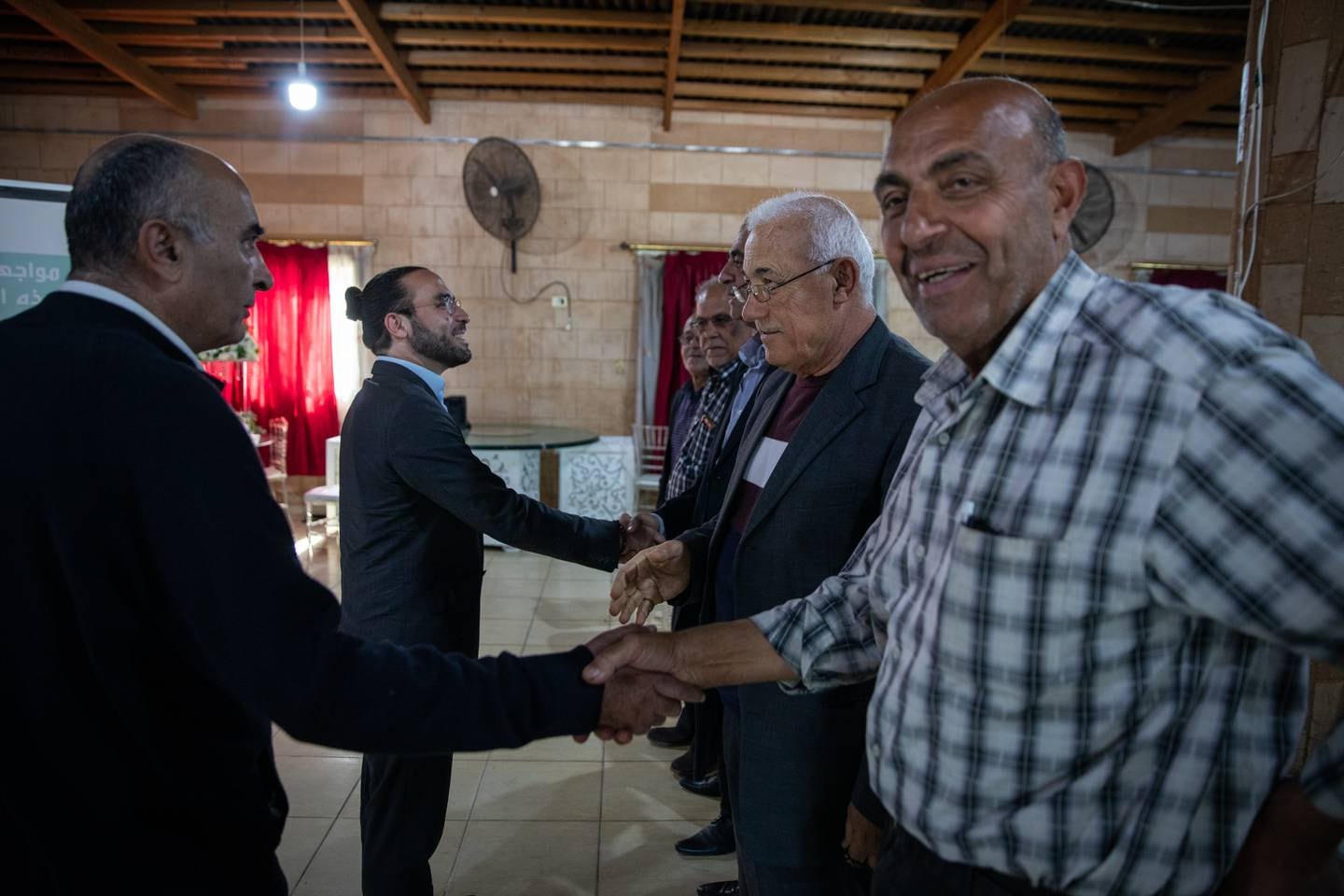 LEBANON: Saturday 16 April 2022  Ali Khalifeh, Shiite opposition candidate for Al-Zahrani in Southern Lebanon, greets supporters in the restaurant hall in Sarafand where an opposition rally is being hosted. Oliver Marsden