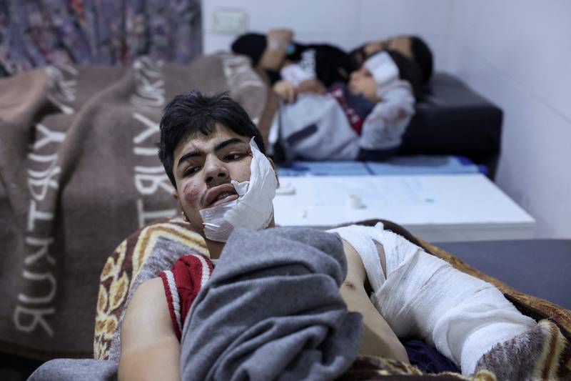 People receive treatment at Al Rahma hospital in the Syrian town of Darkush. AFP