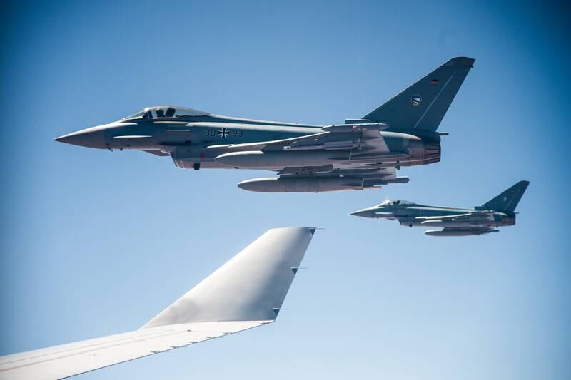 Two German Eurofighter Typhoons fly alongside an Airbus A330 during exercises in Australia's Northern Territory. EPA
