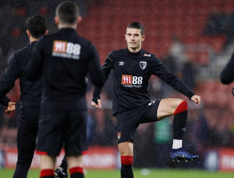 Bournemouth signed winger Alex Dobre on loan from Wigan Athletic. Reuters