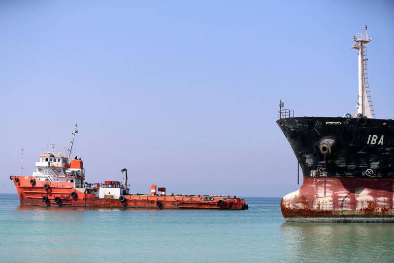 Umm Al Quwain, United Arab Emirates - Reporter: N/A. News. People prepare to tow the Mt Iba oil tanker that ran aground in Umm Al Quwain. Tuesday, February 16th, 2021. Dubai. Chris Whiteoak / The National