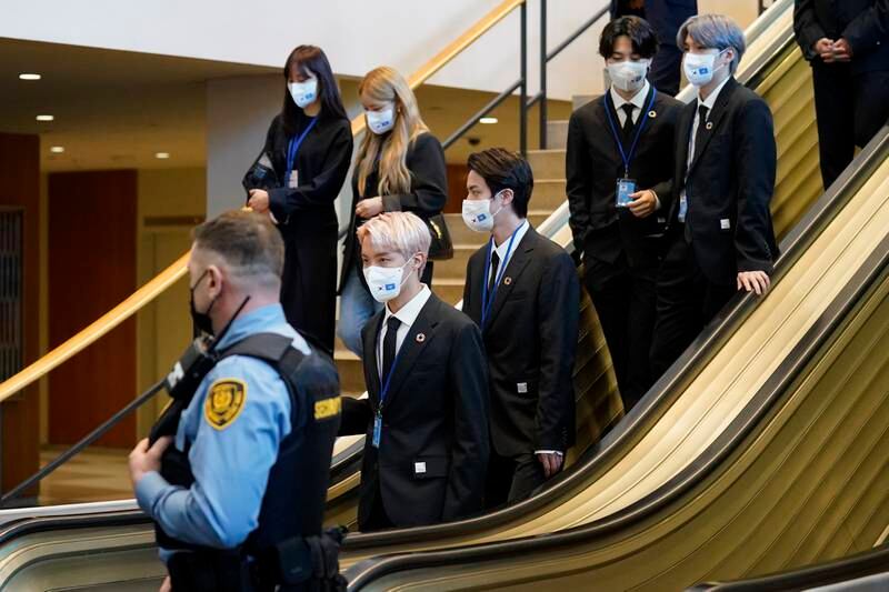 Members of BTS descend an elevator at United Nations headquarters. EPA