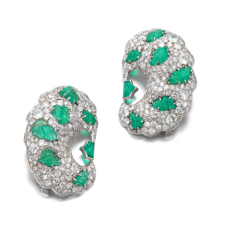This pair of emerald and diamond brooches has an estimated value of about $10,00 to $15,000. Courtesy Sotheby's