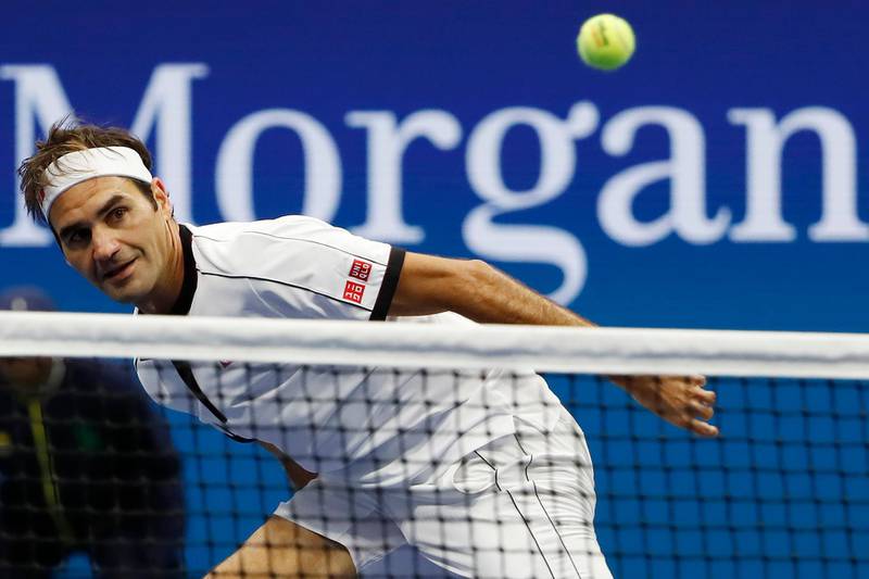 Roger Federer eyes the ball as it passes the net. Reuters