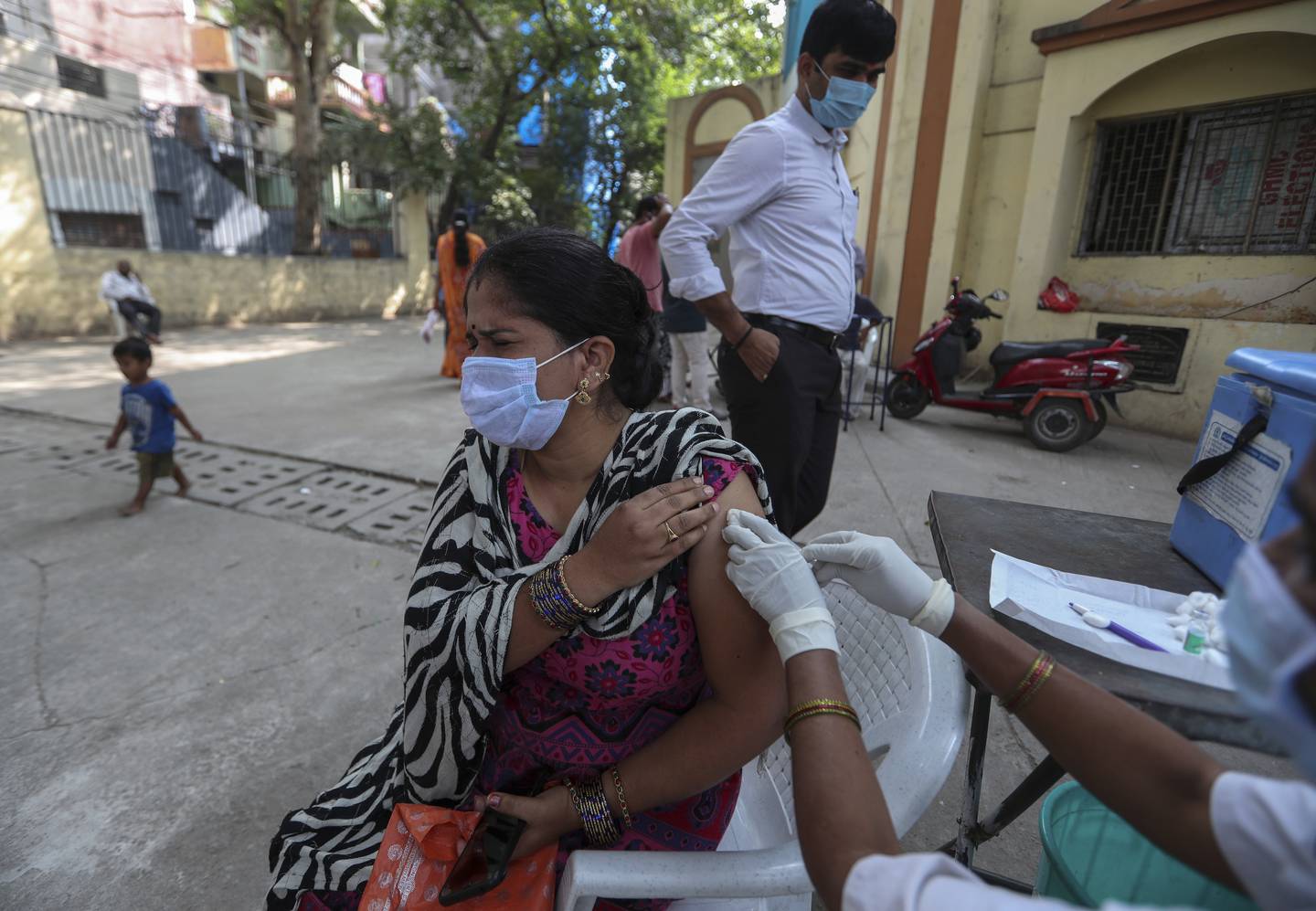 A health worker administers the Covishield coronavirus vaccine in Hyderabad, India, on December 15, 2021. AP