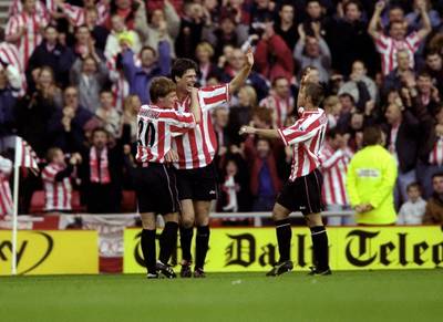 31 Oct 1999:  Niall Quinn of Sunderland celebrates his goal against Tottenham Hotspur with team mates Stefan Schwarz and Kevin Phillips during the FA Carling Premiership match at the Stadium of Light in Sunderland, England. Sunderland won 2-1. \ MandatoryCredit: Clive Brunskill /Allsport