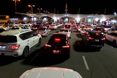 Cars wait in line to enter Bahrain from Saudi Arabia on the King Fahd Causeway after Saudi citizens were allowed to travel outside the kingdom for the first time in 14  months. Reuters