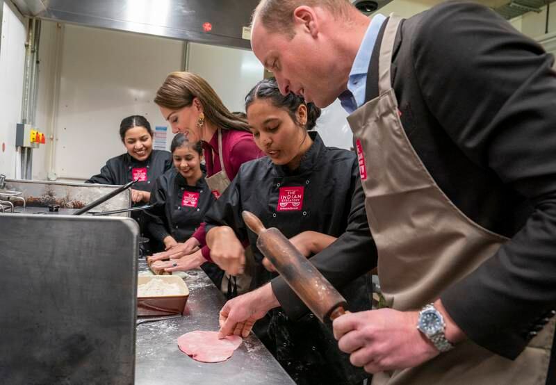 Prince William and wife Kate learn how to make Indian street food. Getty