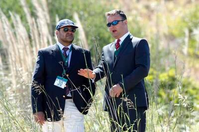 Luis Mota Carmo (L), head of the Policia Judiciaria in the Algarve, speaks to British Det Chief Insp Andy Redwood as scrubland in in Praia da Luz is searched, in June 2014.