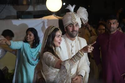 The couple outside Vastu, Ranbir Kapoor's home and the wedding venue, after the ceremony.