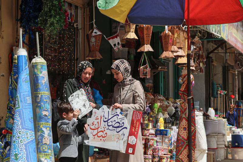 Palestinians shop at Al-Zawya old market in Gaza city in preparation for Ramadan. AFP
