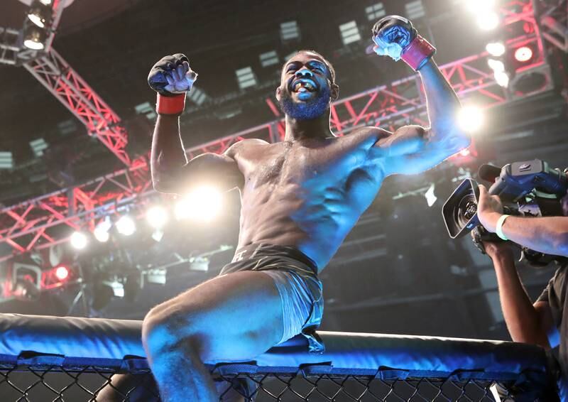 Aljamain Sterling celebrates his win in the bantamweight title fight at UFC 280 in Abu Dhabi on Saturday, October 22, 2022. Chris Whiteoak / The National