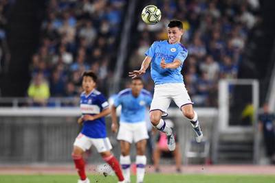 Manchester City's midielder Phil Foden heads the ball during a friendly football match between English Premier League club Manchester City and Japan League Yokohama F. Marinos at the Yokohama Stadium, in Yokohama on July 27, 2019. (Photo by CHARLY TRIBALLEAU / AFP)