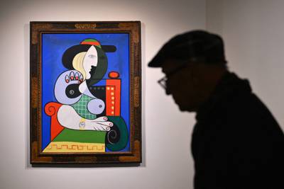 Pablo Picasso's painting Femme a la montre before the auction. AFP