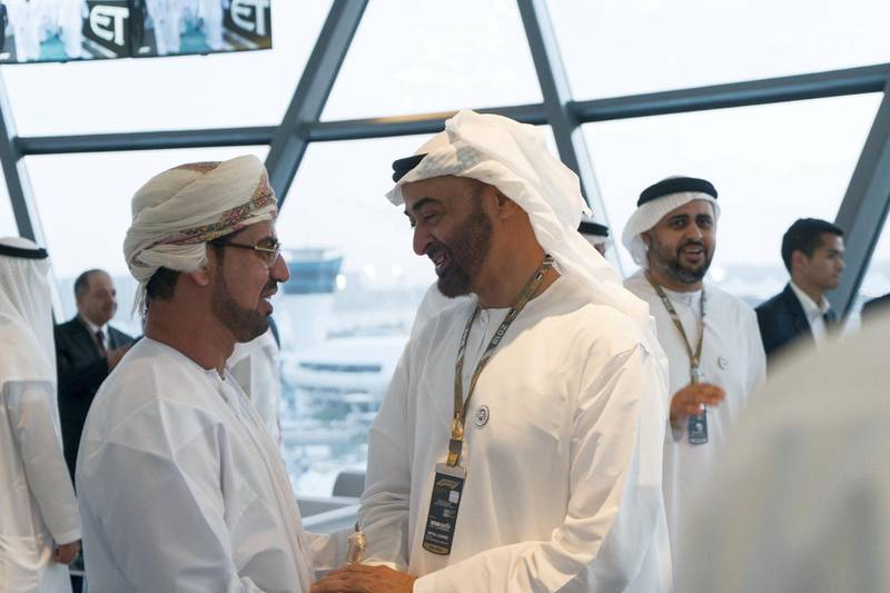 ABU DHABI, UNITED ARAB EMIRATES - November 24, 2018: HH Sheikh Mohamed bin Zayed Al Nahyan, Crown Prince of Abu Dhabi and Deputy Supreme Commander of the UAE Armed Forces (R) and HE Dr Khaled Saeed Salem Al Jaradi, Ambassador of Oman to the UAE (L), attend the final day of Formula 1 Etihad Airways Abu Dhabi Grand Prix, at Shams Tower. Seen with HH Sheikh Theyab bin Mohamed bin Zayed Al Nahyan, Chairman of the Department of Transport, and Abu Dhabi Executive Council Member (back R).

( Rashed Al Mansoori / Ministry of Presidential Affairs )
---