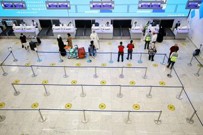 Travellers gather in the departure hall of Kuwait international Airport. AFP