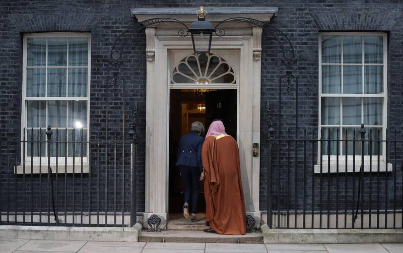 Britain's Prime Minister Theresa May (L) and Saudi Arabia's Crown Prince Mohammed bin Salman (R) go inside 10 Downing Street, in central London on March 7, 2018.
British Prime Minister Theresa May will "raise deep concerns at the humanitarian situation" in war-torn Yemen with Saudi Crown Prince Mohammed bin Salman during his visit to Britain beginning Wednesday, according to her spokesman. / AFP PHOTO / Daniel LEAL-OLIVAS