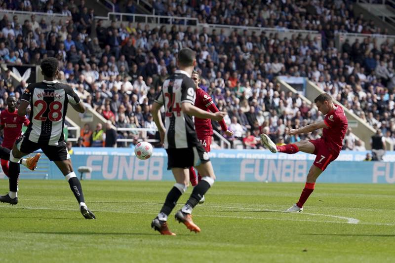 Liverpool's James Milner shoots in the Premier League game against Newcastle United at St James' Park. AP