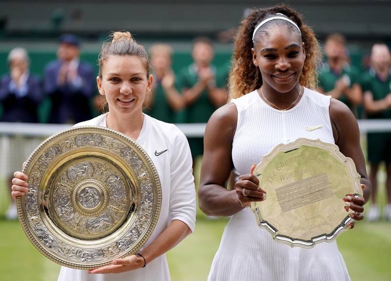 Simona Halep, left, and Serena Williams pose with their trophies after their match. EPA