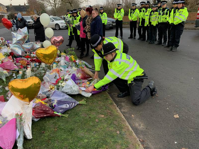 Twenty-one officers from West Midlands Police on Tuesday lay bouquets of flowers near the scene in Babbs Mill Park in Kingshurst, Solihull, after the boys' deaths. PA