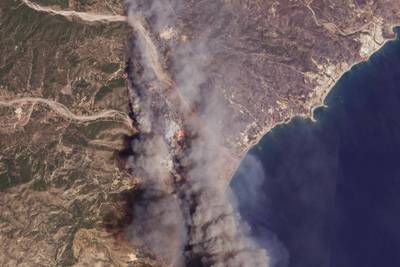 A satellite image shows the fires burning on the Greek resort island of Rhodes. AP