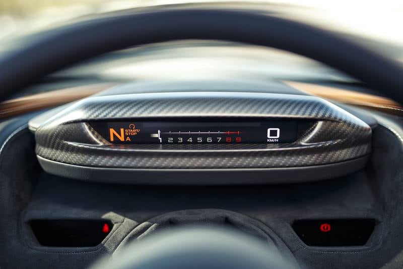 The driver enjoys a no-compromise dash with McLaren’s traditional steering that’s free of buttons and other distractions