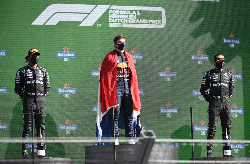 Race winner Max Verstappen on the podium alongside Lewis Hamilton, left, who finished second and third-placed Valtteri Bottas. Reuters