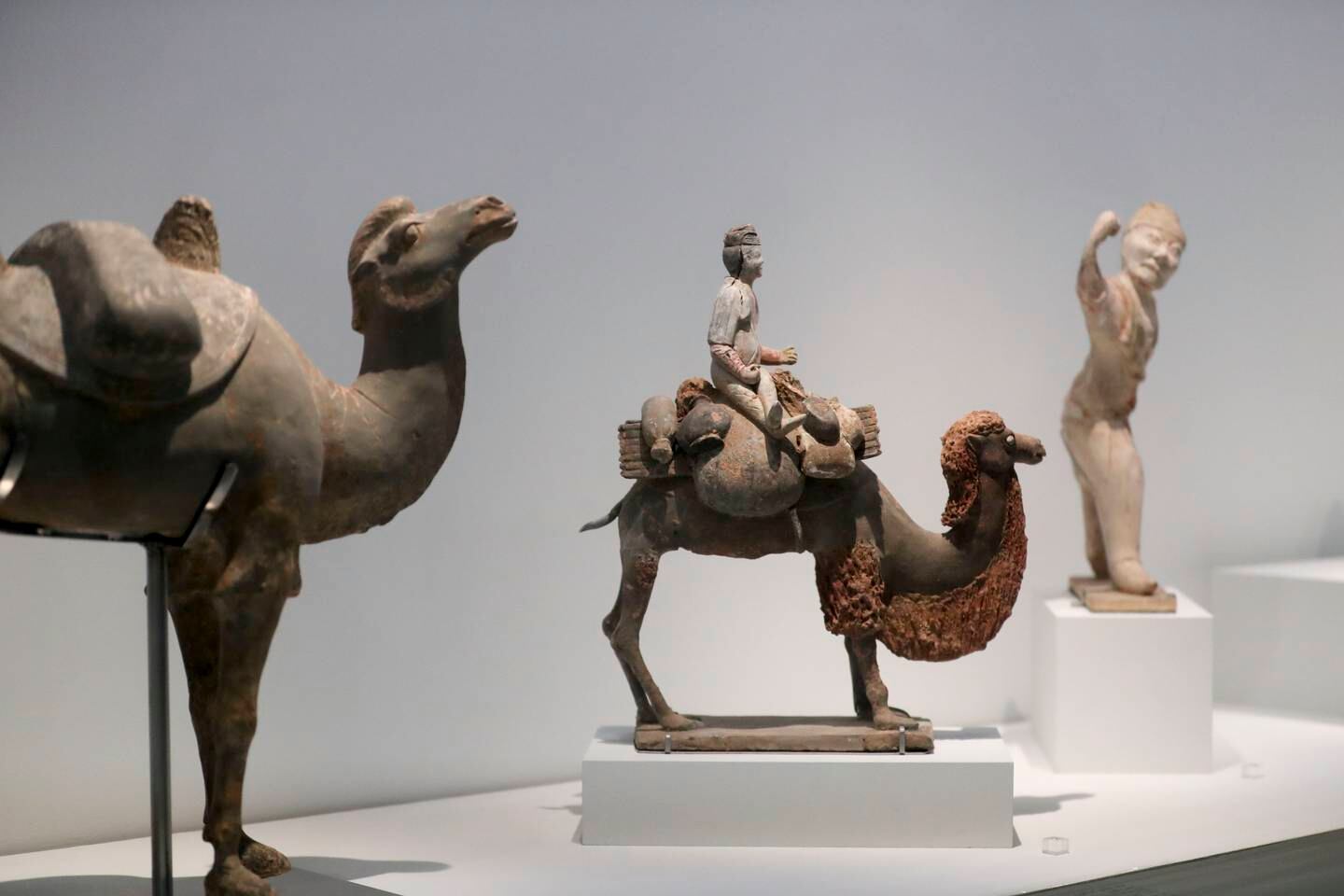 Funerary figure of a caravaner on a camel from Northern China. Khushnum Bhandari / The National
