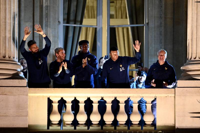 Left to right: France's Olivier Giroud, Antoine Griezmann, Aurelien Tchouameni, Kylian Mbappe and Didier Deschamps greet supporters. AFP