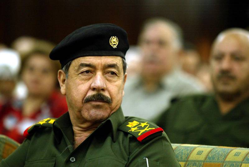 Ali Hasan al-Majid, senior member of Iraq's ruling Revolution Command Council (RCC) and Iraqi President Saddam Hussein's cousin attends a conference on statistics studies in Baghdad 02 November 2002. Washington is pursuing a military buildup in the Gulf as it looks to the UN Security Council adopting a new resolution on Iraq arms inspection. AFP PHOTO/Karim SAHIB (Photo by KARIM SAHIB / AFP)