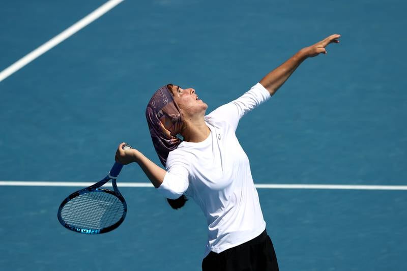 Meshkatolzahra Safi serves to Anja Nayar during their first round match. Getty Images