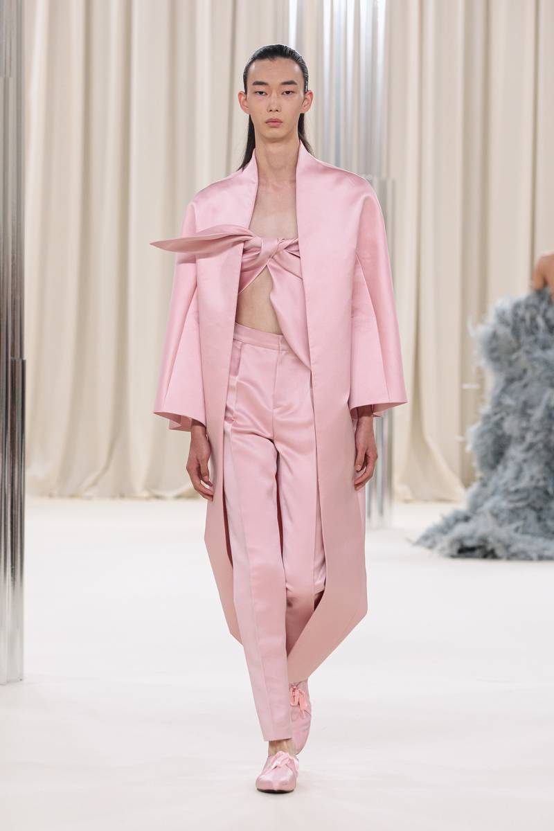 A sleek pink silk suit. 