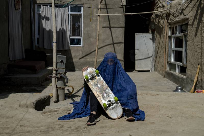 An Afghan girl with her skateboard. Women in once enjoyed sports have faced threats from the Taliban.