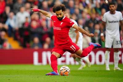 Liverpool's Mohamed Salah scores his side's opening goal from the penalty spot against West Ham at Anfield on Sunday, September 24, 2023. AP