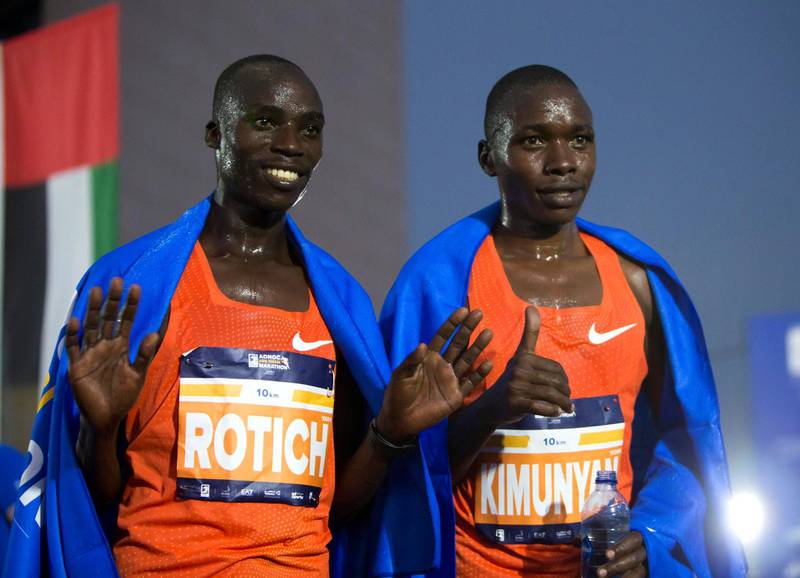 ABU DHABI, UNITED ARAB EMIRATES- Winner of the 10K race Kimunyan (right) and 2nd Rotich at the ADNOC ABU Abu Dhabi Marathon.  Leslie Pableo for The National 