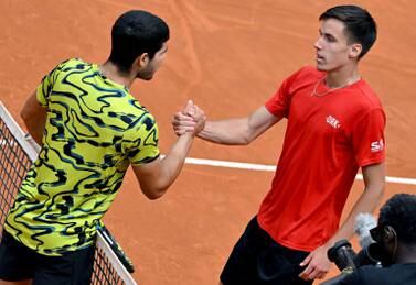Fabian Marozsan (R) of Hungary is congratulated by Carlos Alcaraz of Spain after winning their men's singles third round match at the Italian Open tennis tournament in Rome, Italy, 15 May 2023.   EPA / ETTORE FERRARI