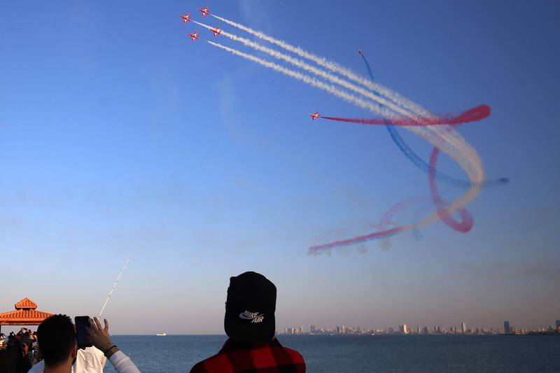 The Red Arrows perform aerial manoeuvres above the skies of Kuwait City. AFP