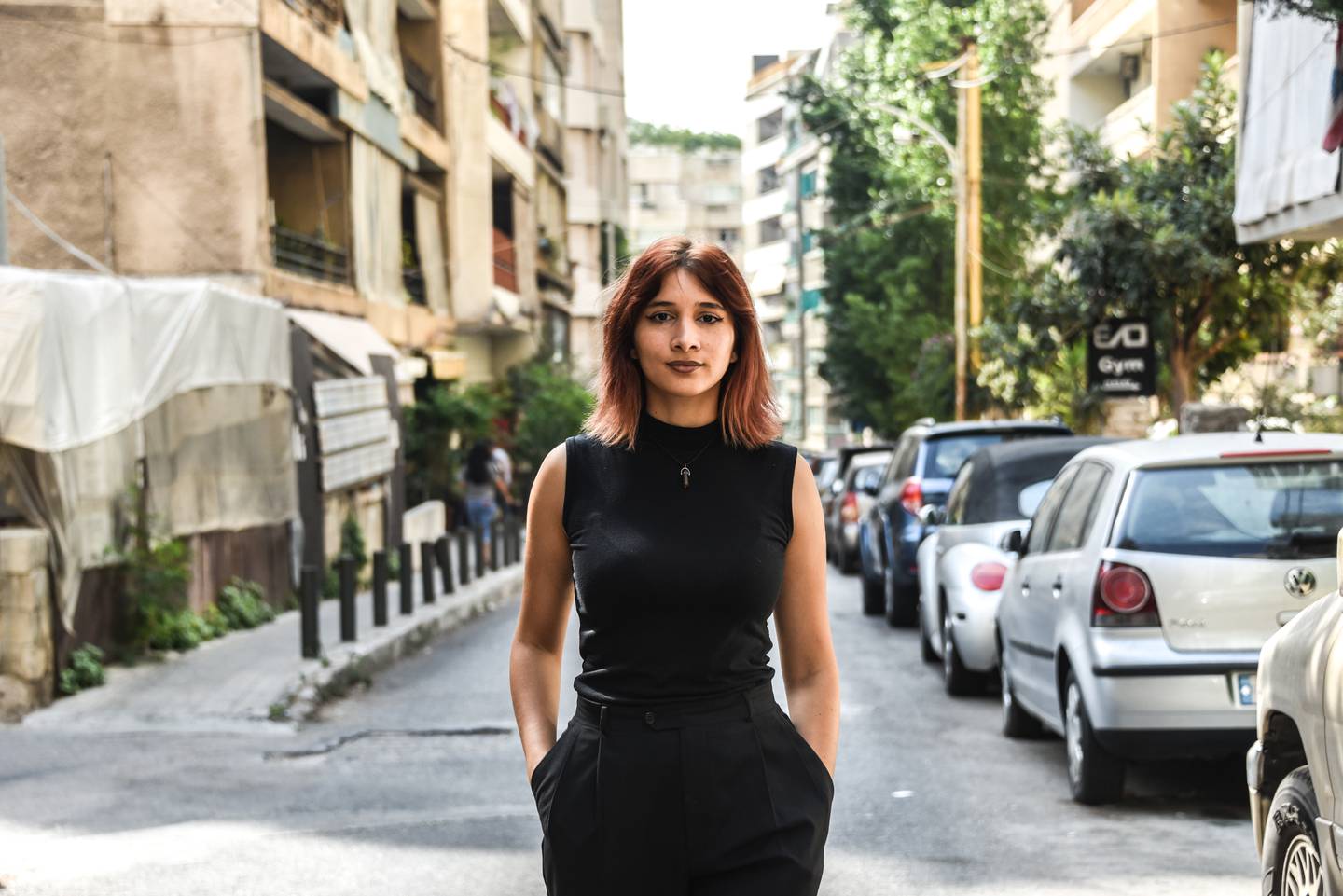 Sukaina Younes walks down a Beirut street. Neither her optometry degree nor building skills have landed her any reliable work in months. Elizabeth Fitt for The National