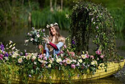 Freya Lee poses as she recreates a floral version of John William Waterhouse’s painting The Lady of Shalott, during a photo call ahead of the Spring Essentials Flower Show in Harrogate. The event  will be the first major gardening show to take place this year. Getty Images